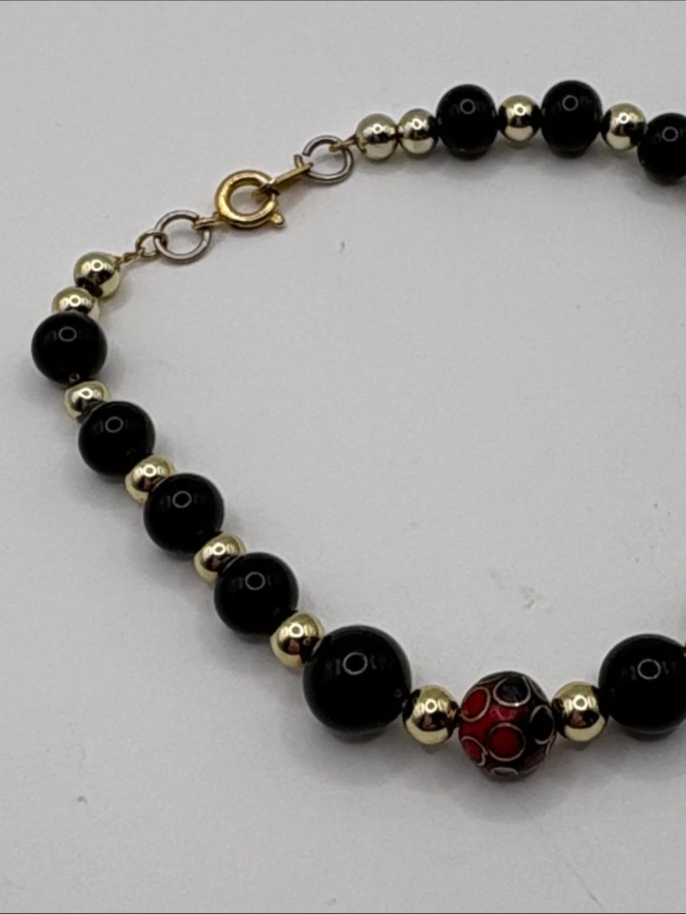Gold Accent Black Bead Bracelet with Red Cloisonné Beads 7.5”